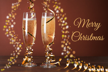 Two glasses of champagne and Christmas decorations.