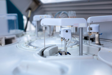 Analyzing process. Close up of white accurate modern apparatus functioning and preparing results while standing in the lab