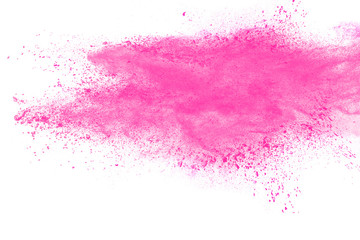 abstract pink dust explosion on white background..Freeze motion of pink powder splattered.