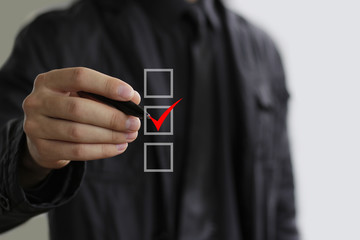 Business man with red check box