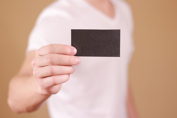 Man showing black card. Leaflet presentation. Pamphlet hold hands. Man show clear offset paper. Sheet template.