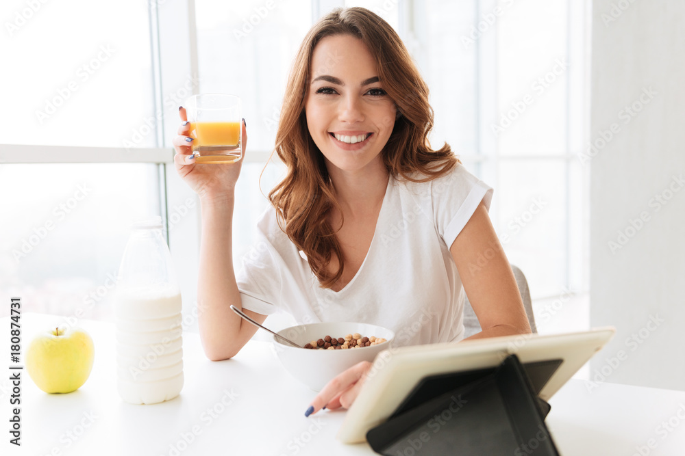 Sticker Lady sitting at the kitchen drinking juice