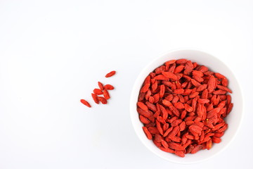 dried goji berries in a small white bowl