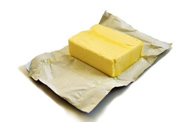 Opened butter package on table. Butter prices are at a record high. cooking with butter.