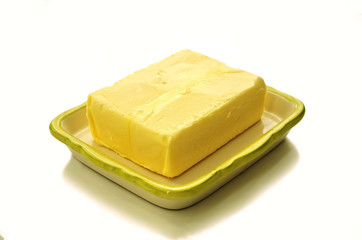  Historically high prices for butter. Butter on plate. 