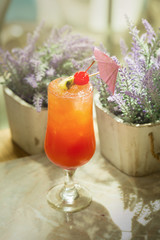 Glass of Passion fruit, pineapple, and pomegranate Cocktail