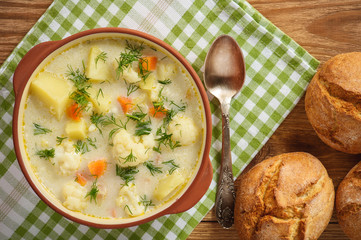 Healthy soup with cauliflower, carrot and potatoes.