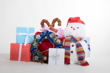 Snowman doll with many gifts boxs on white background