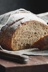 Close-up of chopped fresh rye bread on a linen towel.