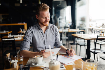 Fototapeta premium Businessman taking notes