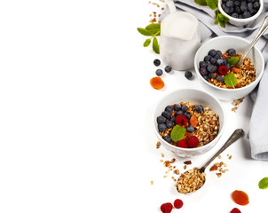 Healthy breakfast -  Homemade granola, honey, milk and berries
