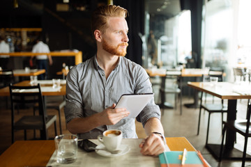 Fototapeta premium Businessman holding tablet
