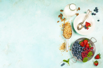 Healthy Breakfast set with granola, almond milk and berries.