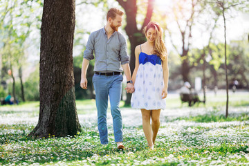 Fototapeta premium Romantic couple walking forest