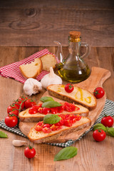 Bruschetta bread with basil and chopped tomatoes. 