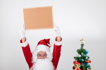 Santa claus holding brown billboard on white background