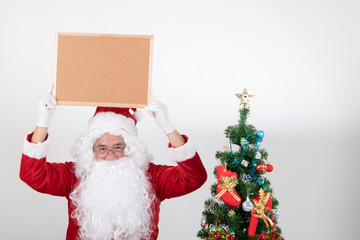 Santa claus holding brown billboard on white background