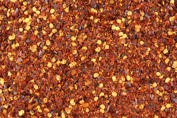 crushed red pepper flakes closeup food background texture