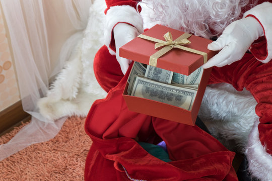 Santa Claus With Money In The Box Gift