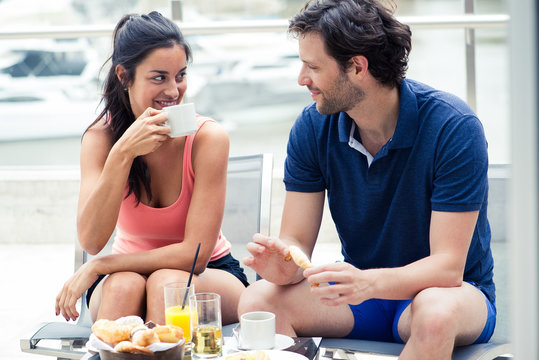 Couple having breakfast together outdoors