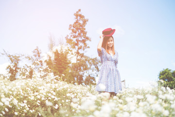 Portrait of Happy Asian woman smiling in The Chrysanthemum garden