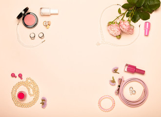 Fototapeta na wymiar Fashionable Women's Cosmetics and Accessories. Falt Lay. Nail Polish and blush. Jewelry and Rings. A bouquet of flowers. Pink roses