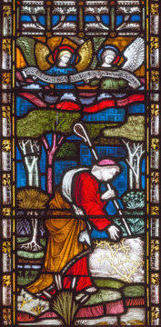 LONDON, GREAT BRITAIN - SEPTEMBER 19, 2017: The parable of of the Lost sheep on the stained glass in St Mary Abbot's church on Kensington High Street.