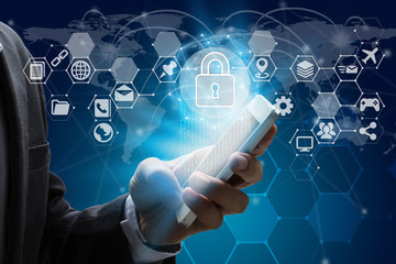 Businessman use smartphone with virtual screen padlock and Interface Icons over the Network connection of World map on technology background