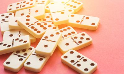 Domino on Pink background. Flat lay