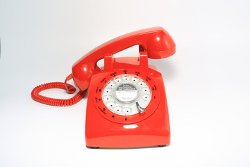 Retro rotary dial phone on call with no body, hang up by hollow man