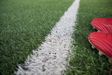 white stripe line on green soccer pitch