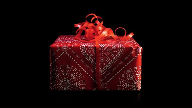 Red christmas gift rotate against black background