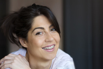Portrait of a beautiful woman with braces on teeth. Orthodontic Treatment. Dental care Concept