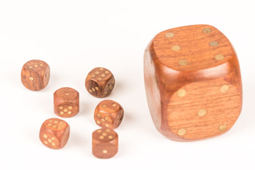 Big and small wooden dices isolated on white background, gambling and lucky concept