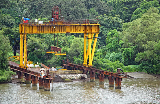 Close Up Of Loading Dock With Gantry Crane For Loading Heavy Components And Segments Onto Barges And Boats For The Construction Of Bridge Across Mandovi River In Goa, India.