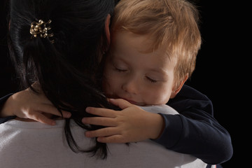 Adoption concept, an orphan is a little boy and his new mother. Happy childhood, caring for...