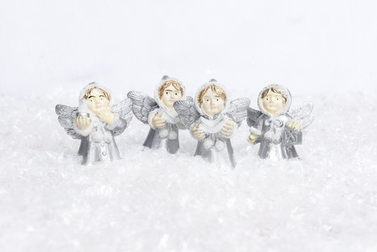 Angels choir singing for christmas in the snow