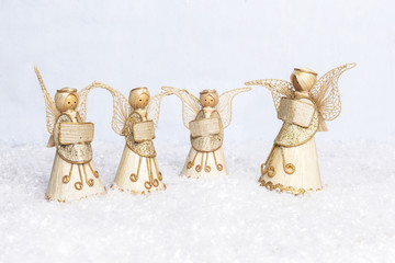 straw angels choir singing for christmas in the snow