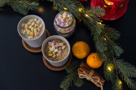 Hot chocolate, marshmallow and other Christmas accessories on the white table, top view