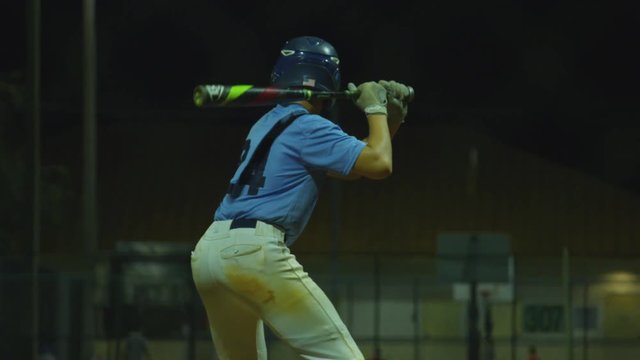 Slow motion of batter hitting a foul ball during baseball game