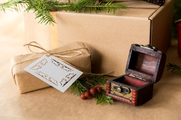 Christmas present wrapped in kraft paper with natural decoration