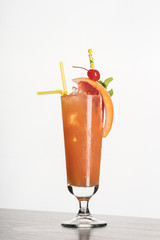 Orange cocktail in a tall glass