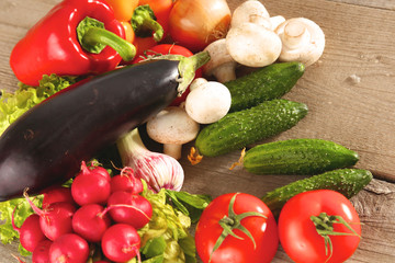 Pile of organic vegetables on a wooden table