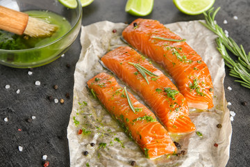 Marinated slices of salmon fillet on table