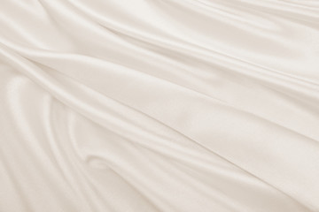 Obraz na płótnie Canvas Smooth elegant golden silk or satin luxury cloth texture as wedding background. Luxurious background design. In Sepia toned. Retro style