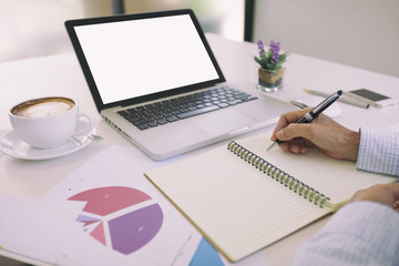 Business woman working on business office desk with laptop, report papers and Office table.