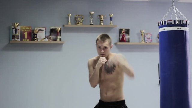 guy boxer trains in the gym