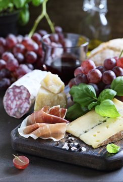 Blue cheese with grapes, nuts and honey. Appetizers table concept for mediterranean lunch oder dinner.Antipasti