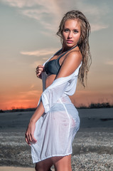 Beautiful woman in a swimsuit on the beach