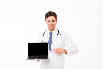 Fototapeta premium Portrait of a smiling young male doctor with stethoscope